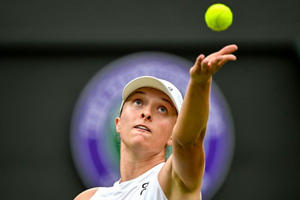 Iga Swiatek Poland serves against Sofia Kenin USA Wimbledon 2024