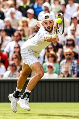 Jacob Fearnley Great Britain stretch backhand v Novak Djokovic Wimbledon 2024