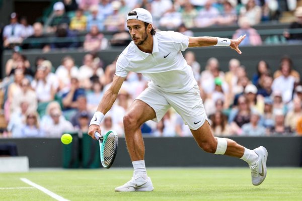 Lorenzo Musetti Italy backhand control v Taylor Fritz USA Wimbledon 2024