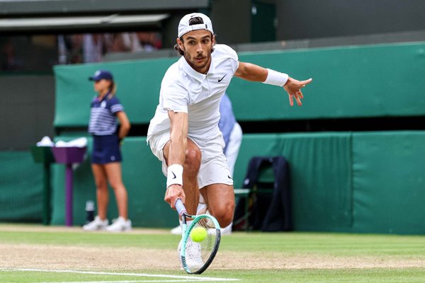 Lorenzo Musetti Italy low backhand v Taylor Fritz USA Wimbledon 2024