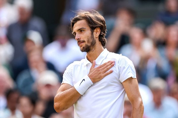 Lorenzo Musetti Italy celebrates match point v Taylor Fritz USA Wimbledon 2024