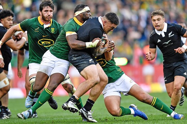 Codie Taylor New Zealand tackled by Handre Pollard & Siya Kolisi South Africa Rugby Championship 2024