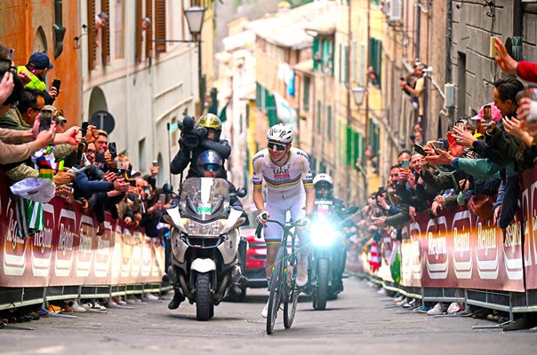 Tadej Pogacar smiles climbing iconic Via Santa Caterina Strade Bianche 2026
